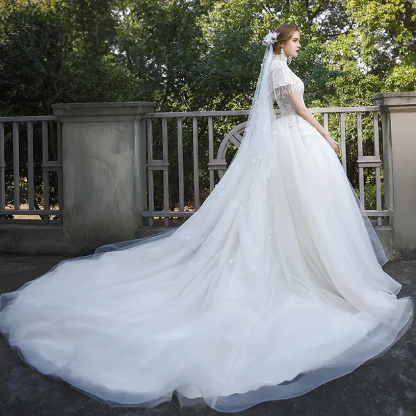 Fashion Ivory Wedding Dresses 2020 Ball Gown High Neck Beading Tassel Sequins Lace Flower Appliques Cap Sleeves Cathedral Train