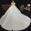 Vintage Audrey Hepburn-Stil Mittelalterlich Ivory / Creme Satin Brautkleider / Hochzeitskleider 2021 Ballkleid Tiefer V-Ausschnitt Geschwollenes Kurze Ärmel Rückenfreies Königliche Schleppe Hochzeit