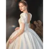Modest / Simple Ivory Satin Wedding Dresses 2021 Ball Gown Square Neckline Short Sleeve Backless Royal Train Wedding
