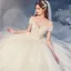 Mode Champagne Bröllopsklänningar 2020 Balklänning Av Axeln Beading Paljetter Spets Blomma Ärmlös Halterneck Royal Train