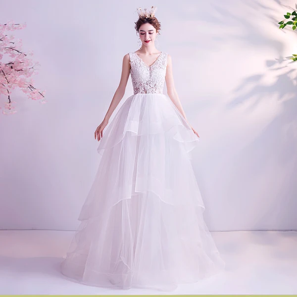 Abordable Blanche Robe De Mariée 2020 Princesse V-Cou En Dentelle Fleur Sans Manches Dos Nu Volants en Cascade Train De Balayage