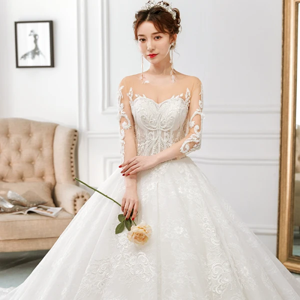 Charmant Ivoire Transparentes Robe De Mariée 2018 Princesse Encolure Dégagée 3/4 Manches Dos Nu Perlage Appliques En Dentelle Volants Royal Train