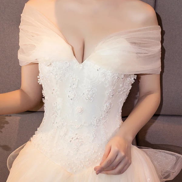 Stunning Champagne Wedding Dresses 2018 Ball Gown Lace Appliques Pearl Sequins Off-The-Shoulder Backless Sleeveless Royal Train Wedding