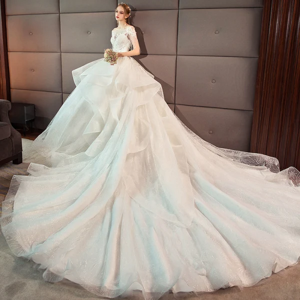 Charming Ivory Wedding Dresses 2019 Ball Gown Scoop Neck Lace Flower Beading Tassel Short Sleeve Backless Cascading Ruffles Cathedral Train Wedding