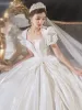 Victorian Style Vintage / Retro Ivory Satin Wedding Dresses 2021 Ball Gown Pearl Square Neckline Puffy Short Sleeve Bow Backless Royal Train Wedding