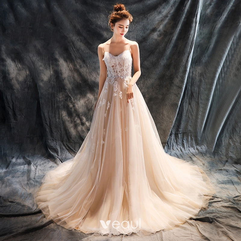Romantic Beach Wedding Dresses 2017 A Line Princess Sleeveless Spaghetti Straps Appliques Lace Flower Beading Backless Champagne Ruffle Tulle Chapel Train