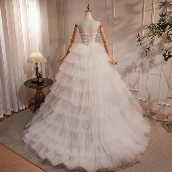 Élégant Ivoire Perlage En Dentelle Fleur Volants en Cascade Robe De Bal 2024 Robe Boule Bretelles Spaghetti Sans Manches Dos Nu Longue Promo Robe De Ceremonie