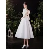 Vintage / Retro Modest / Simple Ivory Satin Wedding Dresses 2021 A-Line / Princess Square Neckline Short Sleeve Backless Bow Tea-length Wedding