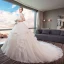 Schöne Ivory / Creme Brautkleider / Hochzeitskleider 2019 A Linie Spaghettiträger Perlenstickerei Spitze Blumen Ärmellos Rückenfreies Fallende Rüsche Kathedrale Schleppe