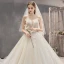Fabuleux Champagne Robe De Mariée 2019 Princesse Bustier Perlage Paillettes Sans Manches Dos Nu Appliques Noeud Royal Train