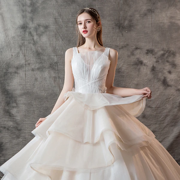 Charming Champagne Wedding Dresses 2019 Ball Gown V-Neck Pearl Sleeveless Backless Cascading Ruffles Cathedral Train