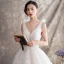 Schöne Ivory / Creme Brautkleider / Hochzeitskleider 2019 A Linie V-Ausschnitt Perlenstickerei Pailletten Perle Spitze Blumen Ärmellos Rückenfreies Kapelle-Schleppe