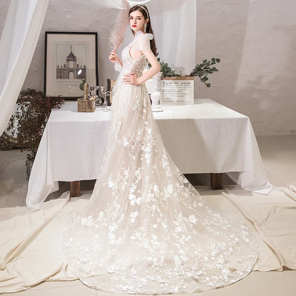 Schöne Ivory / Creme Strand Brautkleider / Hochzeitskleider 2019 A Linie V-Ausschnitt Schleife Spitze Blumen Ärmellos Rückenfreies Hof-Schleppe