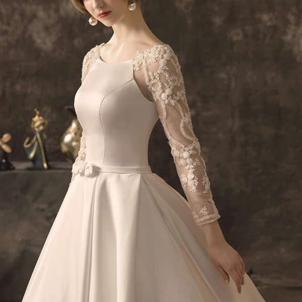 Élégant Ivoire Robe De Mariée 2019 Princesse Encolure Dégagée Noeud En Dentelle Fleur Manches Longues Dos Nu Cathedral Train