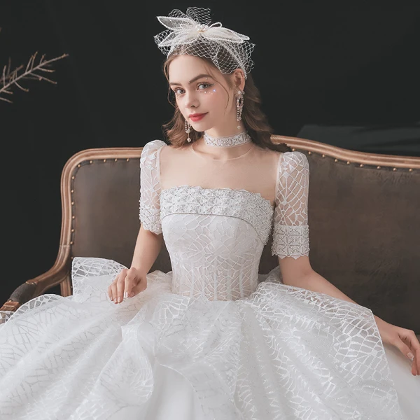 Mode Ivoire Glitter Robe De Mariée 2021 Robe Boule Encolure Dégagée Perlage Faux Diamant Manches Courtes Dos Nu Royal Train Mariage
