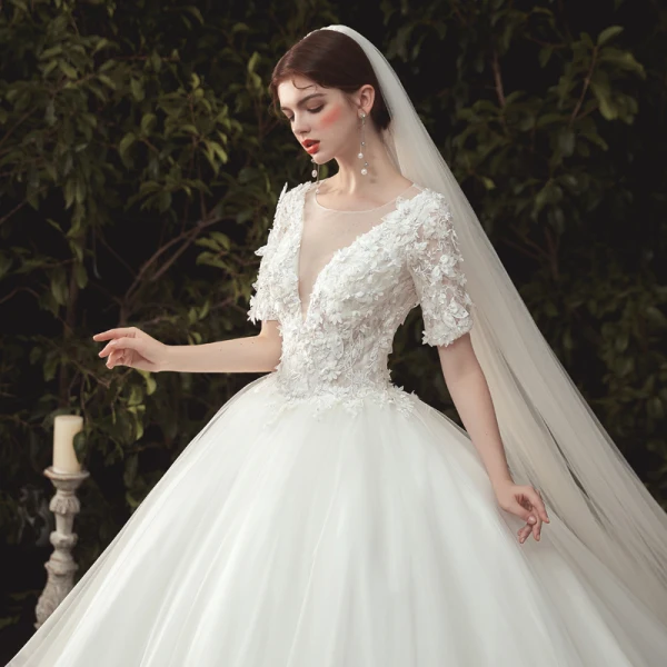 Elegant Ivory Wedding Dresses 2020 Ball Gown Deep V-Neck Pearl Lace Flower Appliques Short Sleeve Backless Cathedral Train