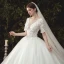 Elegant Ivory Wedding Dresses 2020 Ball Gown Deep V-Neck Pearl Lace Flower Appliques Short Sleeve Backless Cathedral Train