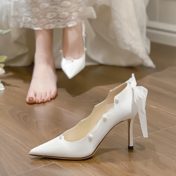 Eleganta Elfenben Pärla Rosett Brudskor 2022 Läder 8 cm Stilettklackar Spetsiga Bröllop Pumps Högklackade