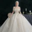 Illusion Champagne Wedding Dresses 2021 Ball Gown Off-The-Shoulder Beading Pearl Rhinestone Sequins Short Sleeve Backless Royal Train Wedding