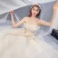 Luxe Champagne Robe De Mariée 2020 Robe Boule Bustier Plumes Perlage En Dentelle Fleur Sans Manches Dos Nu Volants en Cascade Royal Train