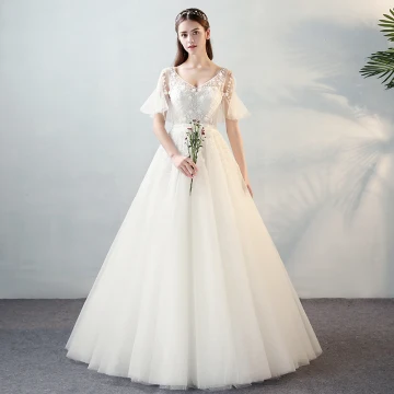 Moderne Mode Ivoire Transparentes Robe De Mariée 2018 Princesse V Cou Manches Courtes Dos Nu Perlage Appliques Fleur Noeud Ceinture Volants Longue