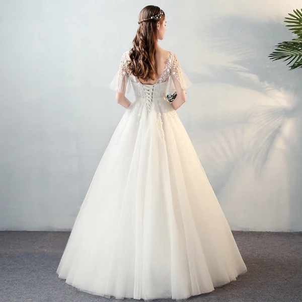 Modern / Fashion Ivory See-through Wedding Dresses 2018 A-Line / Princess V-Neck Short Sleeve Backless Beading Appliques Flower Bow Sash Ruffle Floor-Length / Long