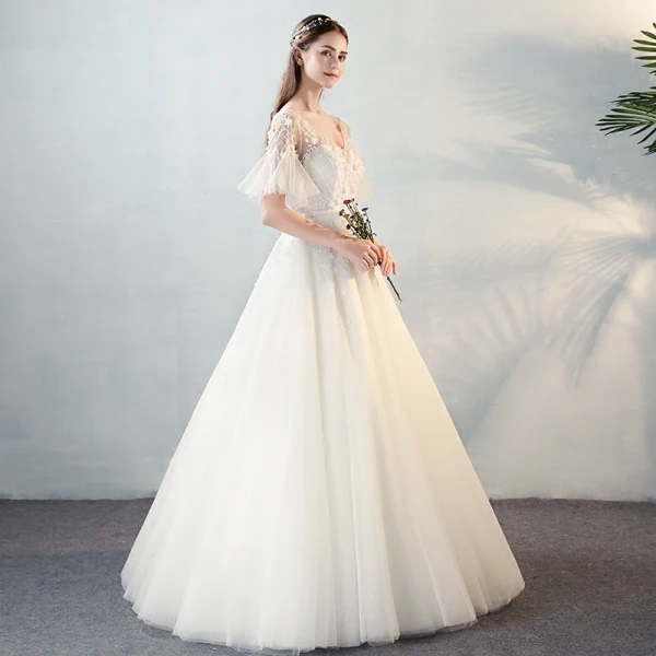 Modern / Fashion Ivory See-through Wedding Dresses 2018 A-Line / Princess V-Neck Short Sleeve Backless Beading Appliques Flower Bow Sash Ruffle Floor-Length / Long