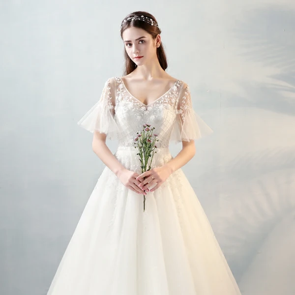 Modern / Fashion Ivory See-through Wedding Dresses 2018 A-Line / Princess V-Neck Short Sleeve Backless Beading Appliques Flower Bow Sash Ruffle Floor-Length / Long