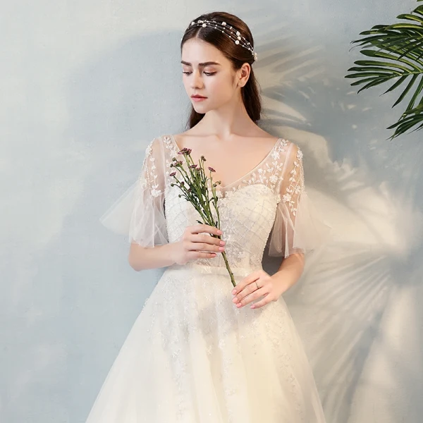 Modern / Fashion Ivory See-through Wedding Dresses 2018 A-Line / Princess V-Neck Short Sleeve Backless Beading Appliques Flower Bow Sash Ruffle Floor-Length / Long