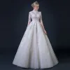 Illusion Champagne Pierced Wedding Dresses 2018 A-Line / Princess High Neck 1/2 Sleeves Appliques Lace Ruffle Floor-Length / Long