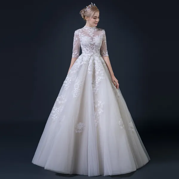 Illusion Champagne Pierced Wedding Dresses 2018 A-Line / Princess High Neck 1/2 Sleeves Appliques Lace Ruffle Floor-Length / Long