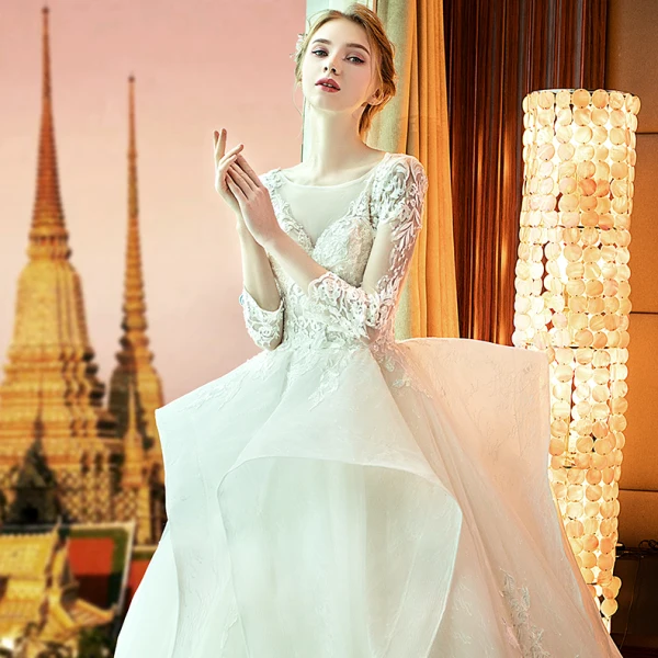 Audrey Hepburn Style Champagne Wedding Dresses 2019 Ball Gown See-through Scoop Neck Lace Appliques 3/4 Sleeve Backless Cascading Ruffles Royal Train