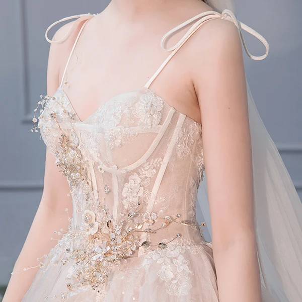 Elegant Champagne Wedding Dresses 2019 Ball Gown Spaghetti Straps Bow Beading Rhinestone Pearl Lace Flower Appliques Sleeveless Backless Royal Train