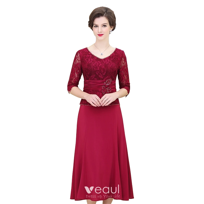 tea length burgundy mother of the bride dresses SL Fashions Women's Sequined Blouson Midi Dress - Navy main image 0