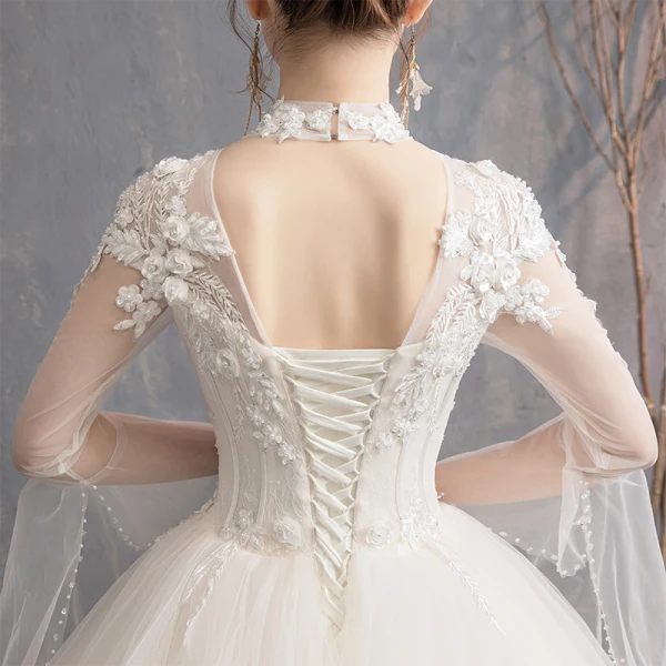 Élégant Champagne Robe De Mariée 2019 Princesse Col Haut Appliques En Dentelle Fleur Perlage Perle Paillettes Manches Longues Dos Nu Longue