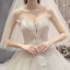 Fabuleux Champagne Robe De Mariée 2019 Princesse Bustier Perlage Paillettes Sans Manches Dos Nu Appliques Noeud Royal Train