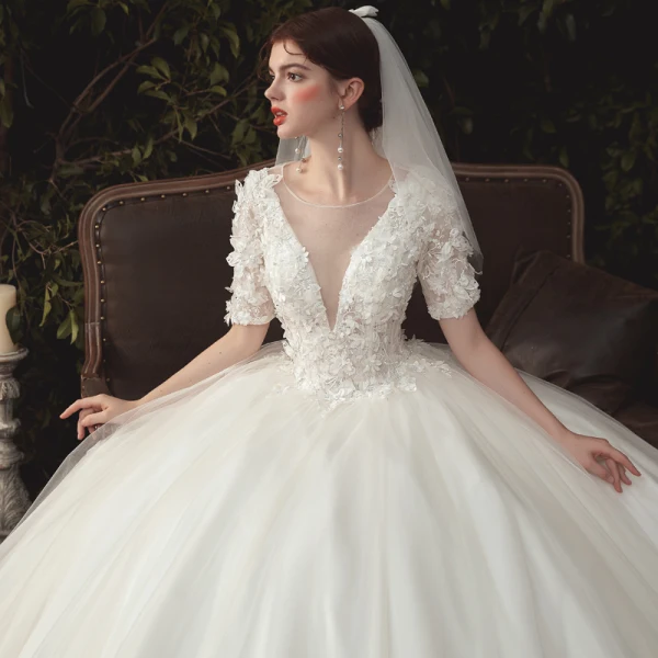 Elegant Ivory Wedding Dresses 2020 Ball Gown Deep V-Neck Pearl Lace Flower Appliques Short Sleeve Backless Cathedral Train