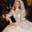 Vintage / Originale Médiévale Ivoire Robe De Mariée 2021 Robe Boule Encolure Dégagée Perlage Perle Paillettes En Dentelle Fleur 3/4 Manches Noeud Dos Nu Royal Train Mariage