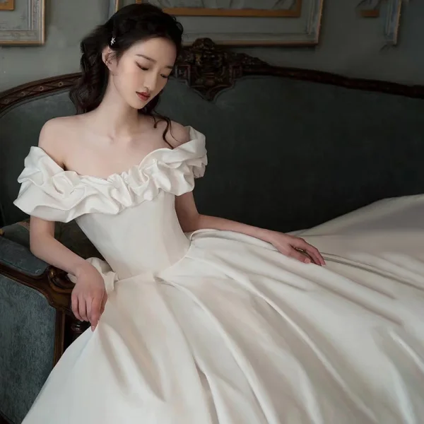 High-end Modest / Simple Ivory Satin Wedding Dresses 2021 Ball Gown Ruffle Off-The-Shoulder Short Sleeve Backless Royal Train Wedding