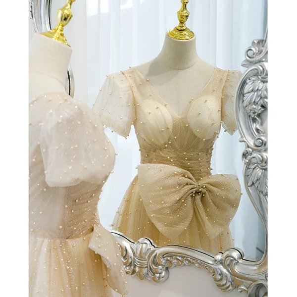 Élégant Champagne Robe De Bal Princesse 2021 V-Cou Noeud Paillettes Perle Manches Courtes Dos Nu Longue Robe De Ceremonie