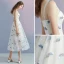 Chic / Belle Ivoire Été de retour Robe De Graduation 2018 Princesse épaules Sans Manches Tachetée Impression Thé Longueur Volants Dos Nu Robe De Ceremonie