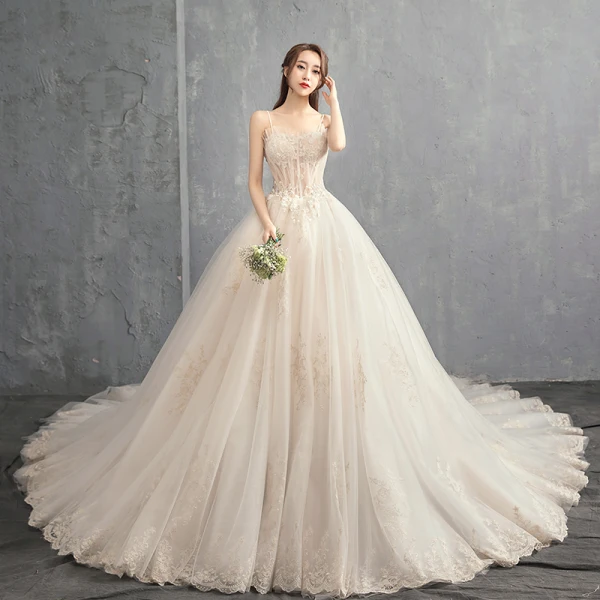 Elegant Champagne Wedding Dresses 2018 Ball Gown Spaghetti Straps Sleeveless Backless Appliques Lace Beading Ruffle Cathedral Train Elegant Champagne Wedding Dresses 2018 Ball Gown Spaghetti Straps Sleeveless Backless Appliques Lace Beading Ruffle Cathedral Train