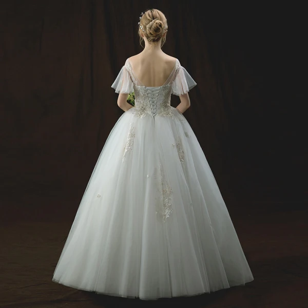 Chic / Beautiful Ivory Wedding Dresses 2018 Ball Gown See-through Scoop Neck Short Sleeve Backless Appliques Lace Rhinestone Beading Floor-Length / Long Ruffle