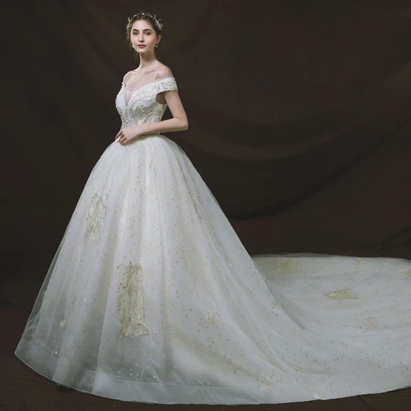 Bling Bling Ivoire Robe De Mariée 2018 Robe Boule De l'épaule Transparentes V-Cou Manches Courtes Dos Nu Glitter Étoile Appliques En Dentelle Perle Perlage Cathedral Train Volants