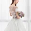 Illusion Ivory Pierced Wedding Dresses 2018 A-Line / Princess Scoop Neck Short Sleeve Appliques Lace Ruffle Chapel Train