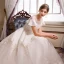 Chic / Belle Champagne Robe De Mariée 2018 Princesse Transparentes Perle Encolure Dégagée Manches Courtes Dos Nu Appliques En Dentelle Paillettes Volants Cathedral Train