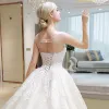 Luxury / Gorgeous Ivory See-through Wedding Dresses 2018 Ball Gown Scoop Neck Sleeveless Backless Appliques Lace Rhinestone Ruffle Cathedral Train