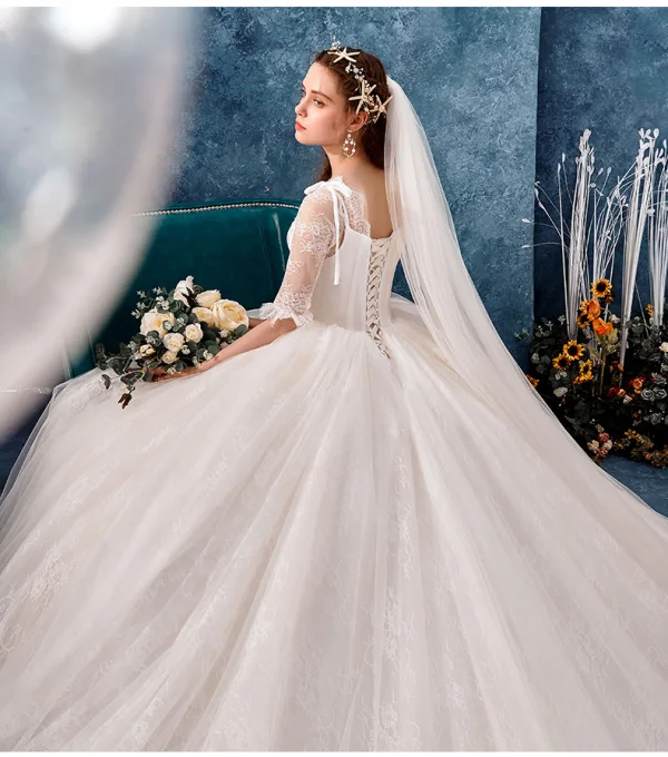 Charmant Ivoire Robe De Mariée 2019 Robe Boule V-Cou Noeud En Dentelle Fleur 1/2 Manches Dos Nu Royal Train