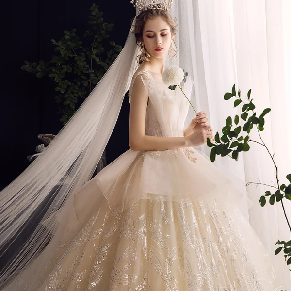 Charming Champagne Wedding Dresses 2020 Ball Gown Ruffle V-Neck Beading Pearl Lace Appliques Sequins Sleeveless Backless Royal Train