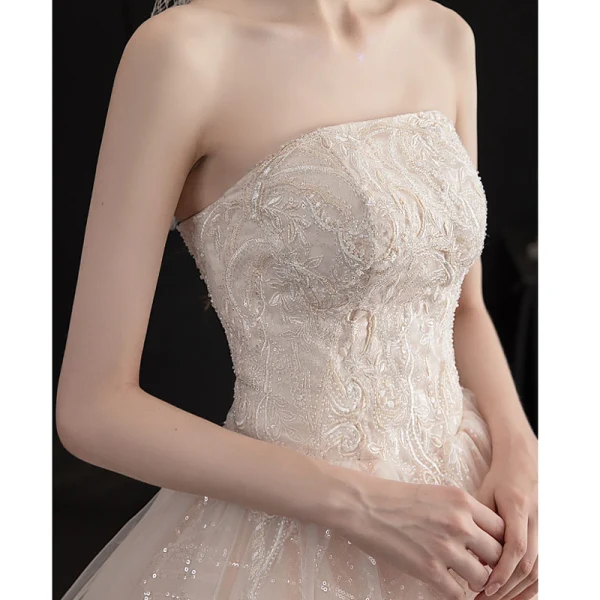 Charmant Champagne Robe De Mariée 2019 Princesse Bustier Perlage Paillettes En Dentelle Fleur Sans Manches Dos Nu Chapel Train